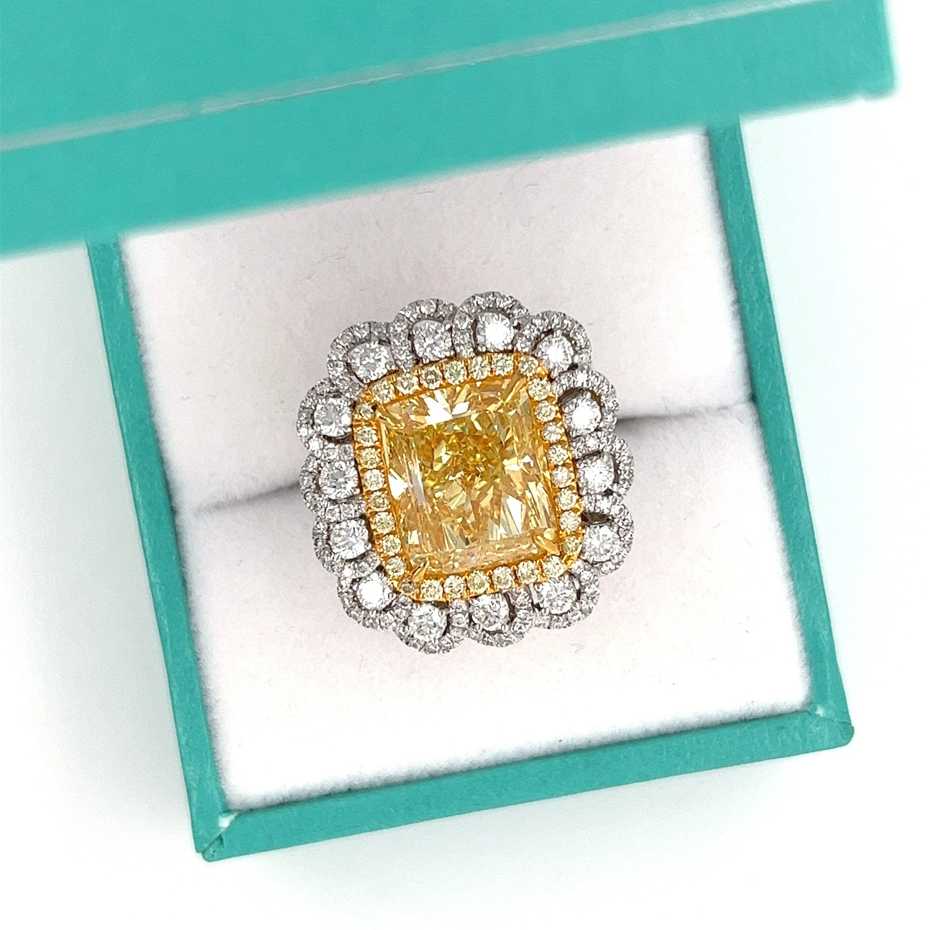 7 Carat Fancy Intense Yellow Radiant Cut Diamond and Diamond Halo Ring | GIA Certified